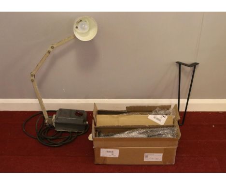 A vintage industrial articulated work light and a box of nine hair pin metal legs. The light is stamped MEM. Light length: 80