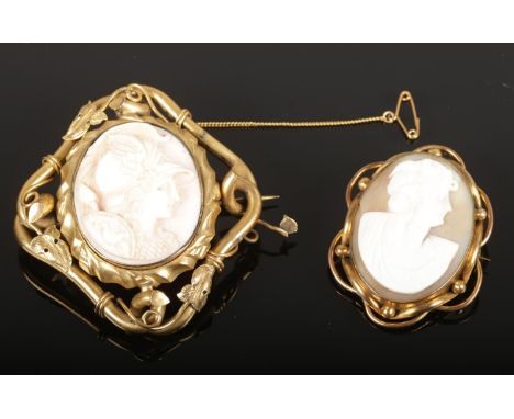 Two cameo brooches - comprising of a shell cameo brooch with portrait of a maiden and a larger brooch depicting the Greek God