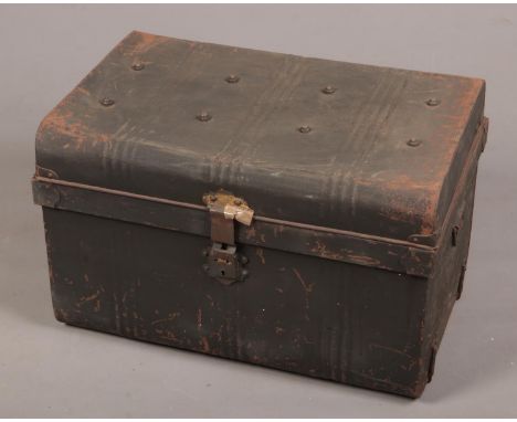 A vintage twin handle tin trunk.  