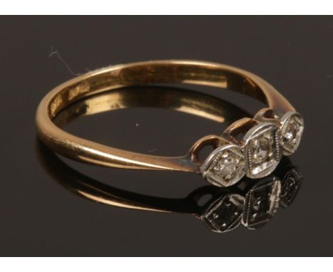 A vintage 18ct gold and 3 stone diamond ring. Size N. Weight 1.92g.  