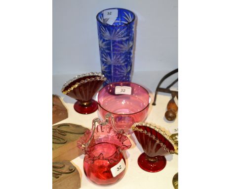 A Victorian cranberry glass posy dish, c.1870;   a pair of ruby flash fan shaped vases;  a cranberry glass bowl;  a blue flas