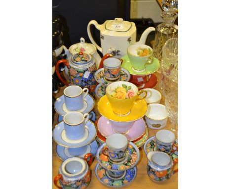 An Edwardian china part tea service, in different shades;  four Doulton coffee cups;  other tea ware