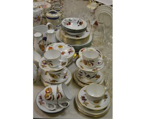 A Royal Worcester Evesham pattern and Evesham Vale part dinner and tea service,including tureens and covers, teacups and sauc