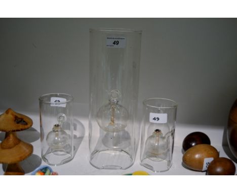 An unusual clear glass oil lamp by Wolford Glass Blowing Co., U.S patented ; others smaller (3)