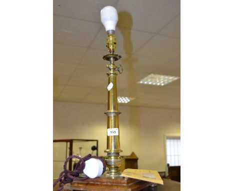A brass gas light converted to electricity mounted on a stepped square oak base

Provenance: Removed from Smedley's Hydro bef