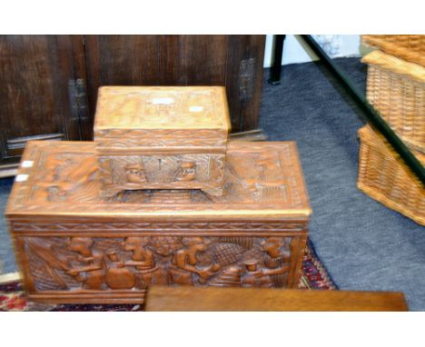 A Nigerian carved hardwood chest; a similar caddy