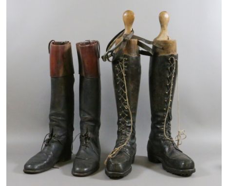 Two pairs of vintage leather writing boots, a pair of wooden boot stretchers and a pair of stirrups.