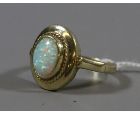 A ladies 9 carat gold ring set with opal. Ring size P.