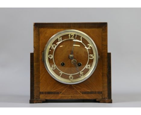 A walnut cased Art Deco 8 day mantel clock chiming half-hourly on a gong.
