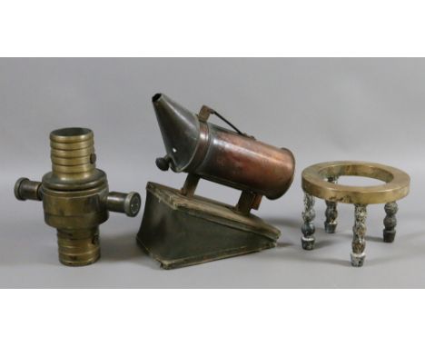 An antique probably C17th bronze and iron trivet along with copper and wood bee smoker and a fire hose nozzle by John Morris 
