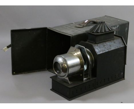 An antique tin cased magic lantern by Varsity Projection Lantern Company, Calcutta, India.
