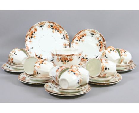 An Edwardian part tea service decorated with flowers approximately forty pieces.