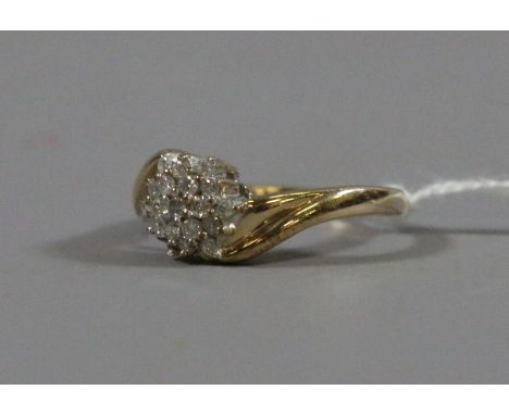 A ladies 9 carat gold and diamond cluster ring set with a .25 ct of diamond. Ring size K.5.