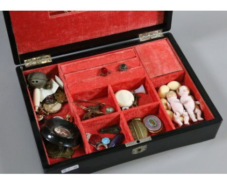 An oriental lacquered musical jewellery box and contents of jewellery to include Stanhope, mourning brooch, bisque jointed do