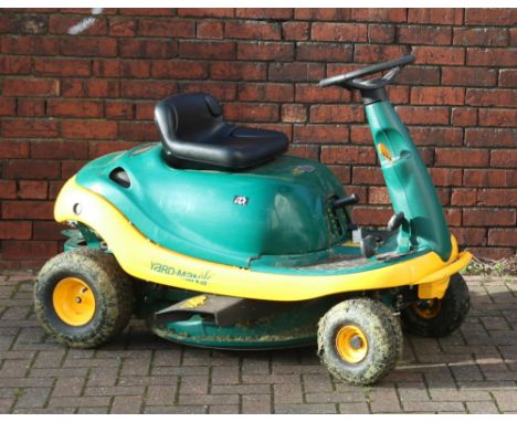A Yardman DX70 ride on lawn mower. Housing a Briggs & Stratton engine. Along with an unused grass box. Running.