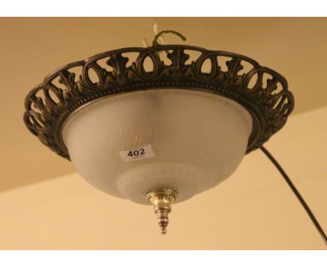 A brushed metal and opaque glass ceiling lamp.