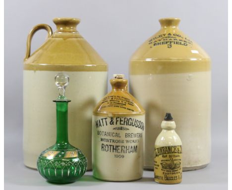 Four stoneware flagons to include advertising examples along with a decorated green glass decanter.