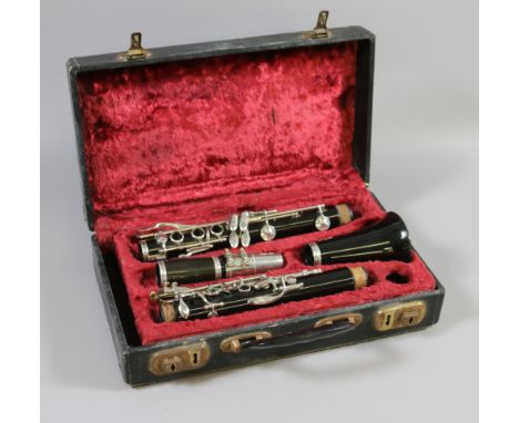 A cased four section Besson of London clarinet.
