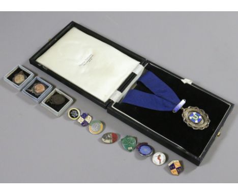 A cased silver and enamelled Don Valley Caledonian Society medal, two silver and silver gilt roller skating medals and other 