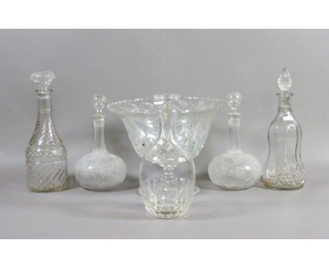 A cut glass centre piece along with five glass decanter and stoppers.