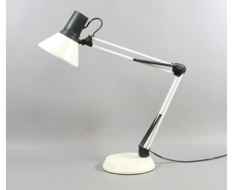 A white anglepoise desk lamp.