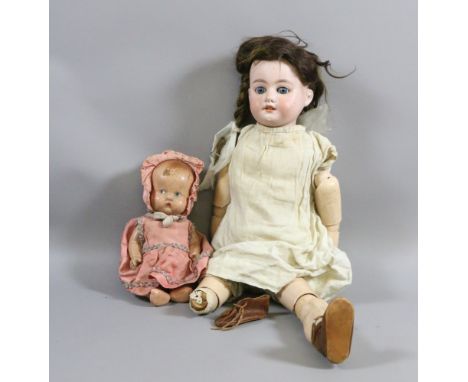 An Armand Marseille bisque headed doll along with one other.