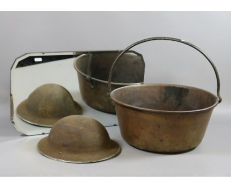 A brass jam pan, World War One soldiers helmet and bevel edge hall mirror.