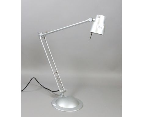 A silvered anglepoise reading lamp.