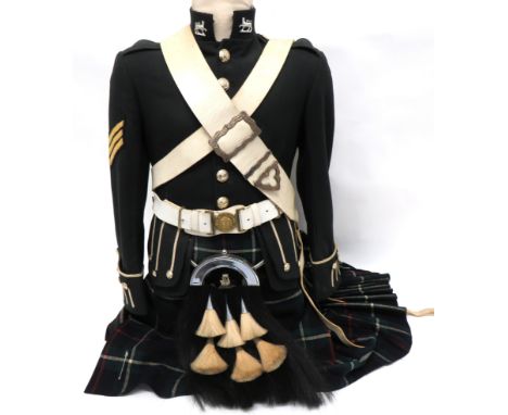 Modern Gordon Highlanders Uniform consisting dark green doublet with high collar. &nbsp;Gauntlet cuffs with white piping deco