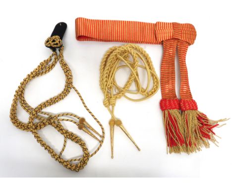 Two Dress Aiguillettes&nbsp; consisting a Royal Navy example with black and gilt cord. &nbsp;Lower gilt terminals with silver