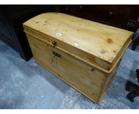 An Antique Stripped Pine Dome Topped Trunk Retaining Key
