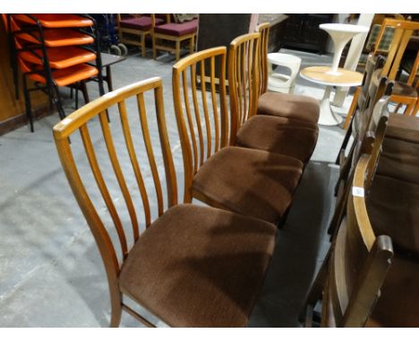 A Set Of 4 1970s Stick Back Dining Chairs