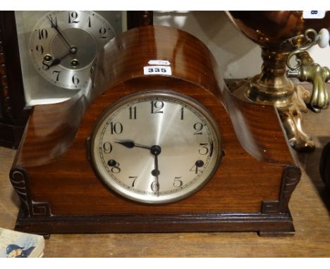 A Polished Mahogany Encased Mantel Clock With Circular Silvered Dial