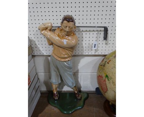 An Unusual Stove Enamel Golfing Figure Poker Stand, 21" High
