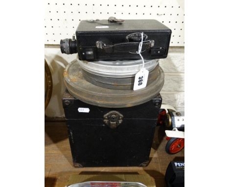 A 16mm Projector, 16mm Camera &amp; 3 Reels Of 16mm Film