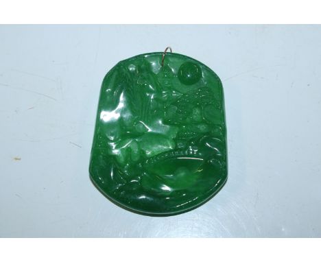 A carved jade type pendant 
