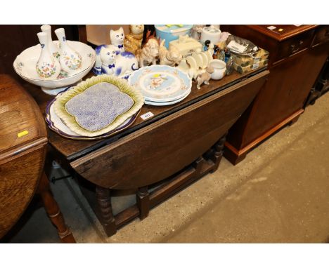 An antique oak gate leg table 