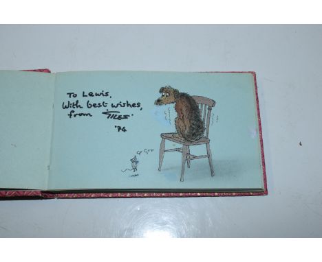 A autograph book  bearing various signatures and a Giles sketch signed