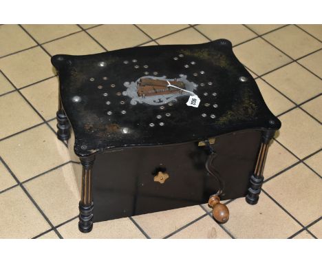 A  LATE 19TH / EARLY 20TH CENTURY EBONISED AND GILT PHOENIX TABLE TOP POLYPHON / ORGANETTE OF RECTANGULAR FORM, central metal