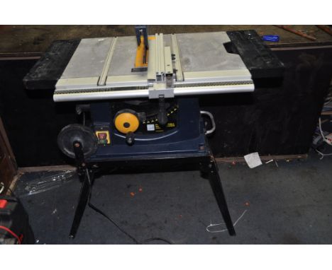 A PERFORMANCE PRO CLM1500TSS TABLE SAW with built in stand, two extension wing, parallel guide (PAT pass and working)Conditio