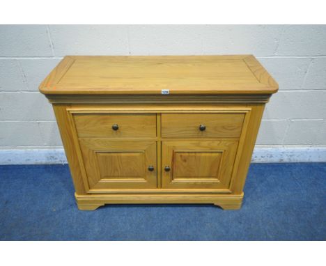 A LIGHT OAK SIDEBOARD, fitted with two drawers above two cupboard doors, width 112cm x depth 48cm x height 87cm (condition re