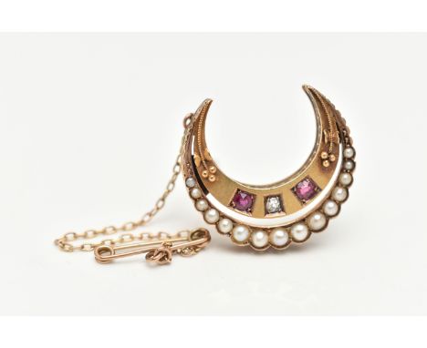 A LATE VICTORIAN SPLIT PEARL, RUBY AND DIAMOND CRESCENT BROOCH, the outer crescent set with graduated split pearls, set with 
