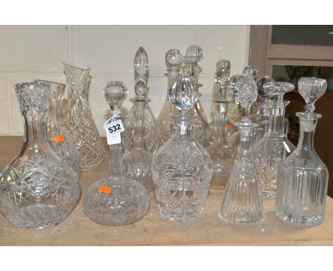 SEVENTEEN DECANTERS AND CARAFES,  to include four Victorian globe and shaft examples, Georgian style mallet decanters,  20th 