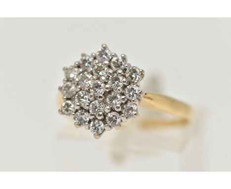 A YELLOW METAL DIAMOND CLUSTER RING, cluster set with round brilliant cut diamonds, estimated total diamond weight 0.55ct, ap