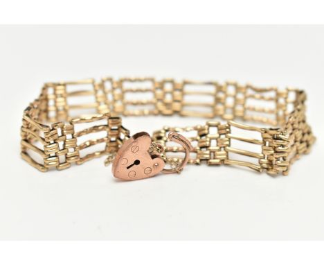 A 9CT GOLD GATE BRACELET, yellow gold four bar gate bracelet, hallmarked 9ct Birmingham, fitted with a rose gold heart padloc