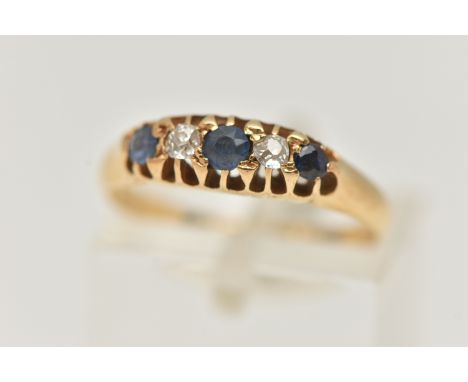 AN EARLY 20TH CENTURY DIAMOND AND SAPPHIRE RING, 18ct yellow gold boat ring, set with three circular cut blue sapphires and t