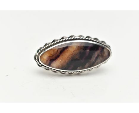 A SILVER BLUE JOHN FLUORITE BROOCH, of an oval form, set with a Blue John cabochon, collet set within a rope twist surround, 
