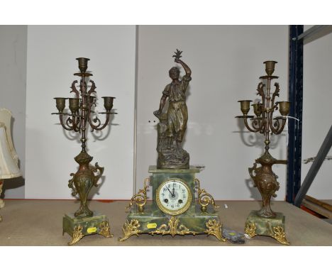 A FRENCH GREEN ONYX CLOCK GARNITURE, with key and pendulum, gilt metal foliate feet, enamel dial marked Turries - Digni, the 