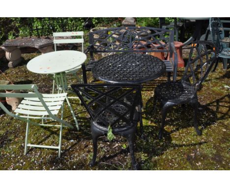 A COLLECTION OF METAL GARDEN FURNITURE including a rickety cast aluminium garden table, two matching chairs, a steel tubular 