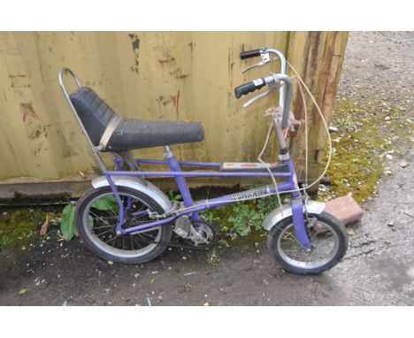 A RALEIGH TOMAHAWK VINTAGE CHILDS BIKE in purple Condition Report: bench seat in good order, paint and chrome work shows sign